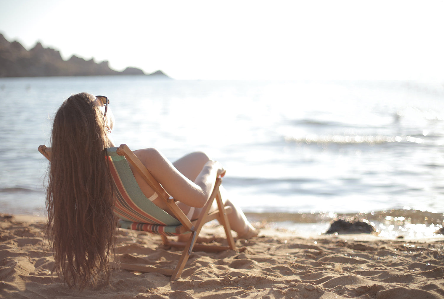 Woman tanning on beach